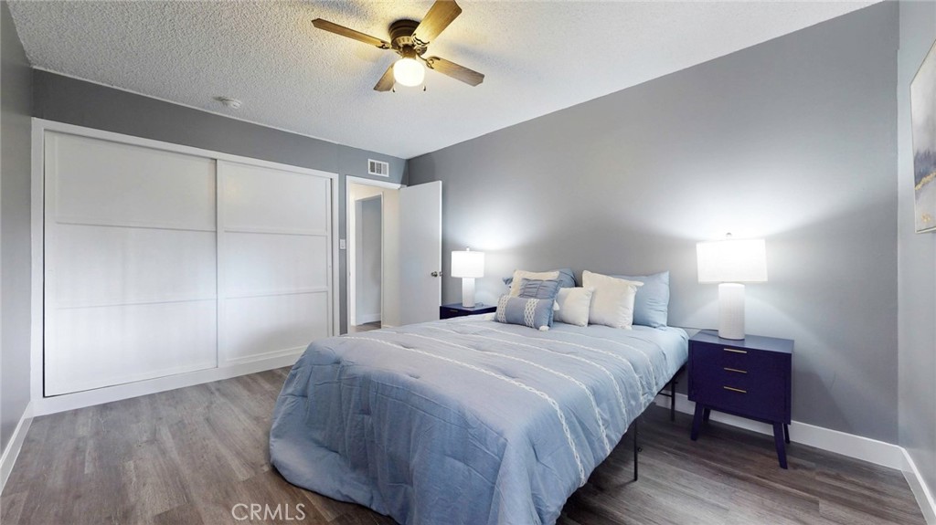 10915 Eldora Avenue Sunland, CA 91040 - Photo 17 of 39 a bedroom with a bed and a chandelier