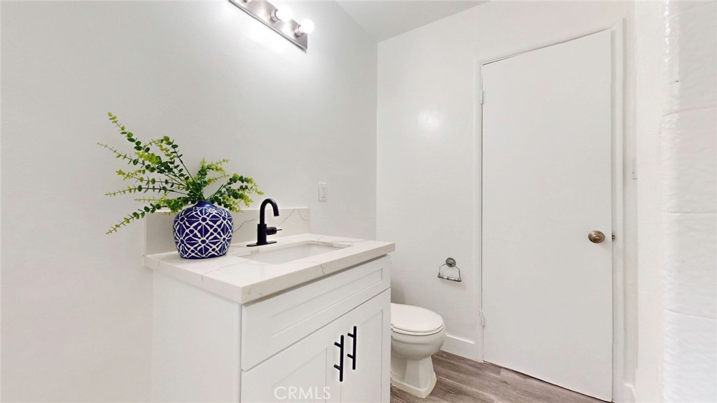 10915 Eldora Avenue Sunland, CA 91040 - Photo 19 of 39 a bathroom with a toilet a sink and a mirror
