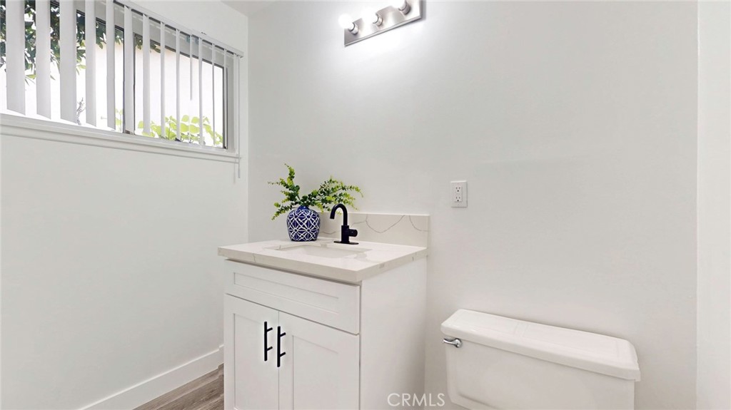 10915 Eldora Avenue Sunland, CA 91040 - Photo 21 of 39 a bathroom with a sink a toilet and a window