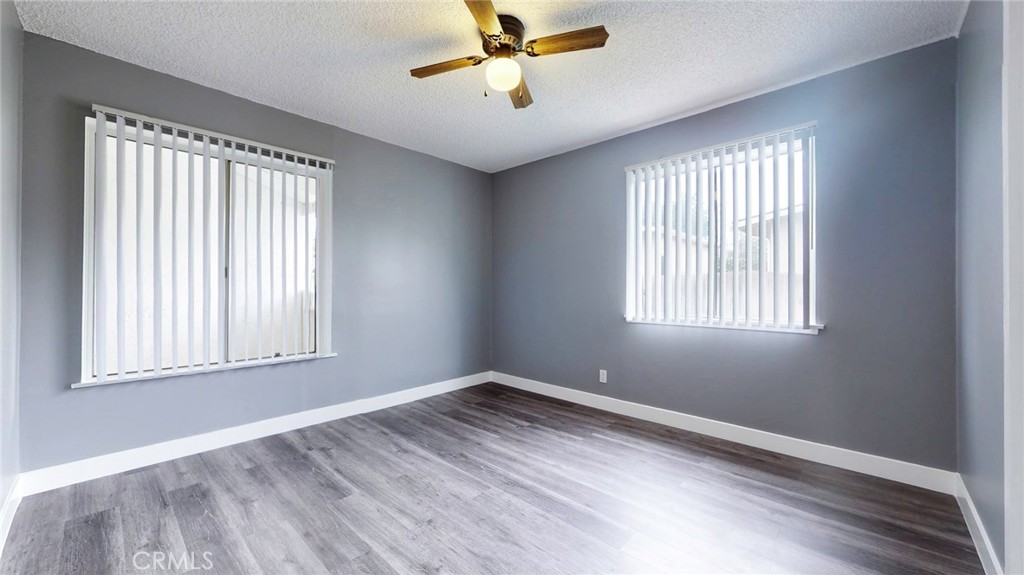 10915 Eldora Avenue Sunland, CA 91040 - Photo 22 of 39 a view of empty room with wooden floor and fan