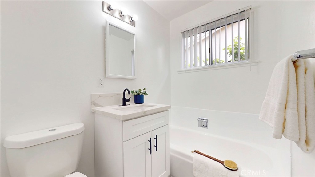 10915 Eldora Avenue Sunland, CA 91040 - Photo 27 of 39 a bathroom with a tub sink and a toilet