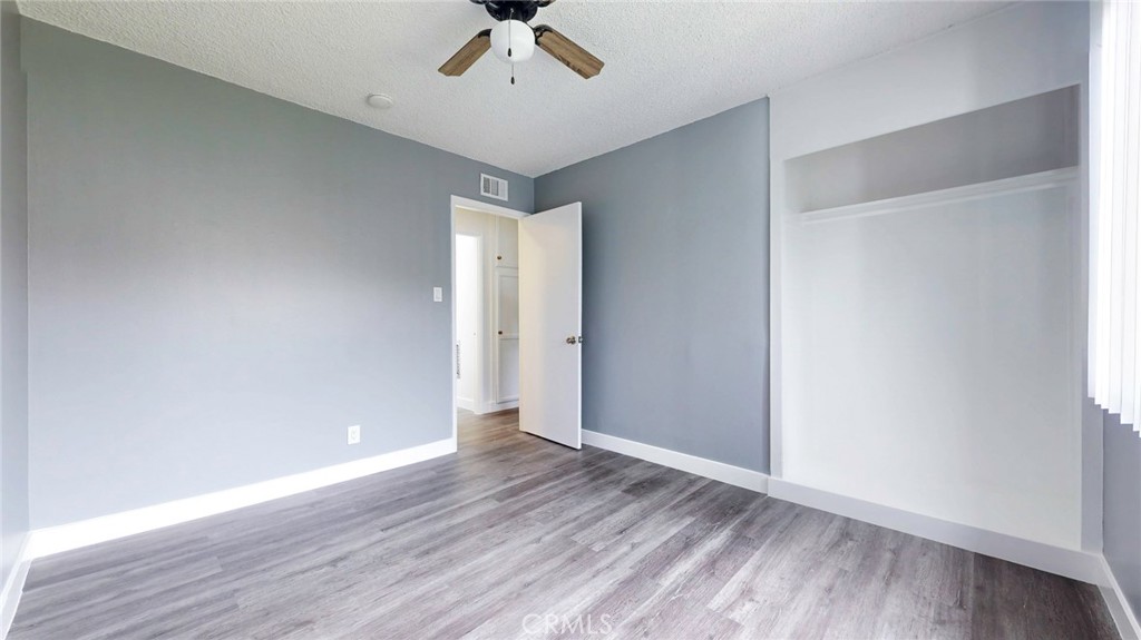 10915 Eldora Avenue Sunland, CA 91040 - Photo 32 of 39 an empty room with wooden floor and windows