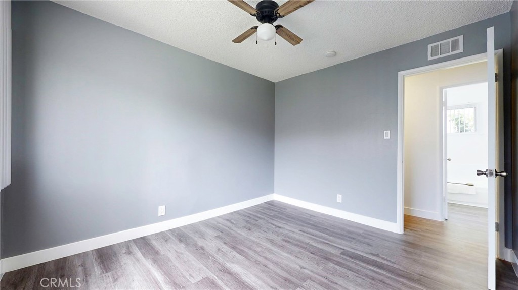 10915 Eldora Avenue Sunland, CA 91040 - Photo 33 of 39 a view of an empty room with window and wooden floor