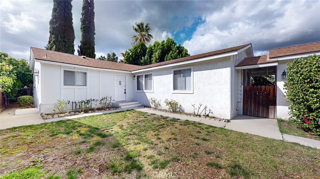 10915 Eldora Avenue Sunland, CA 91040 - Photo 38 of 39 a front view of house with yard