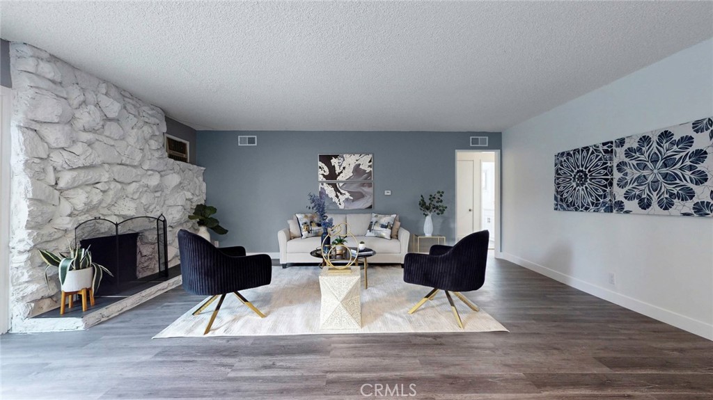 10915 Eldora Avenue Sunland, CA 91040 - Photo 4 of 39 a living room with furniture and a fireplace