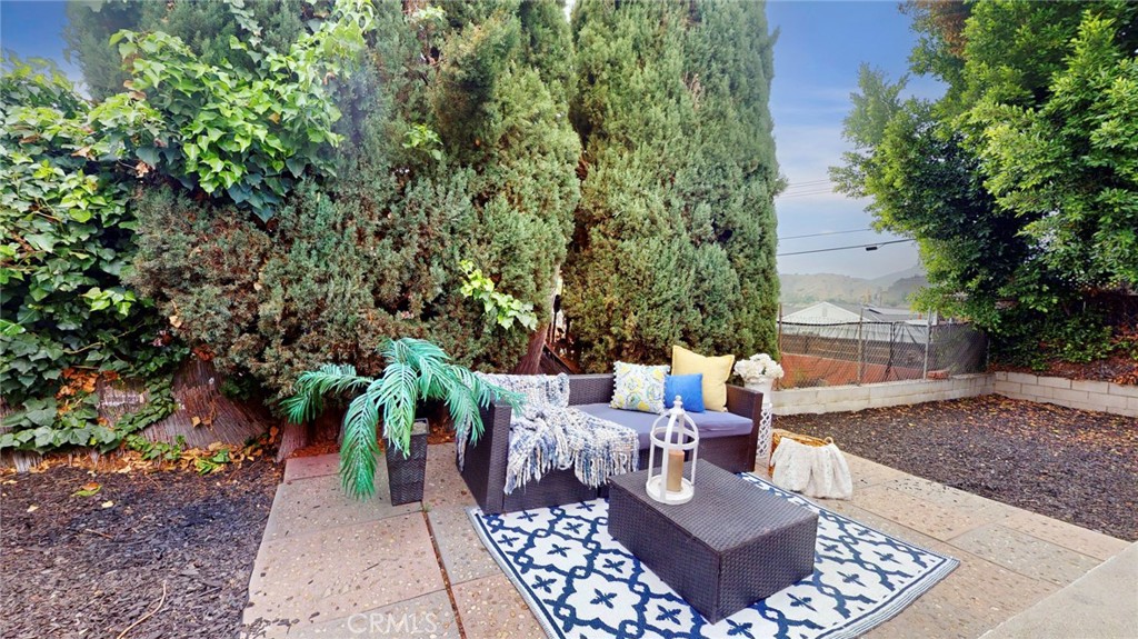 10915 Eldora Avenue Sunland, CA 91040 - Photo 6 of 39 a view of a patio with couches plants and large trees