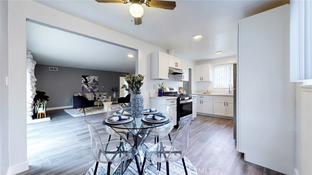 10915 Eldora Avenue Sunland, CA 91040 - Photo 7 of 39 a view of a dining room with furniture and wooden floor