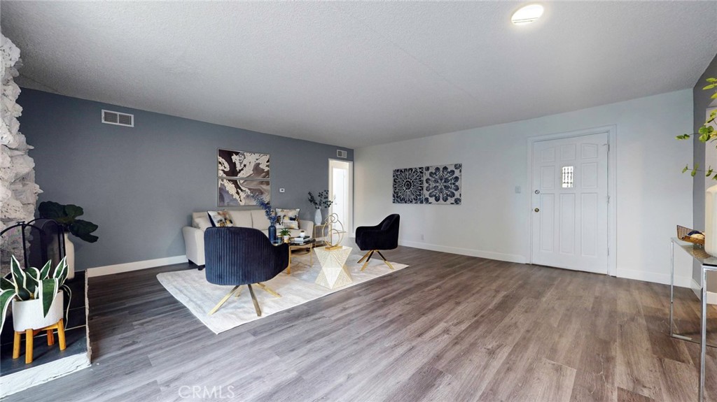 10915 Eldora Avenue Sunland, CA 91040 - Photo 8 of 39 a living room with furniture and a potted plant