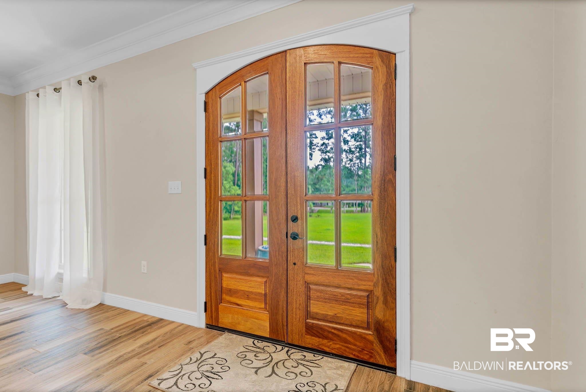 8145 Bay View Drive Foley, AL 36535 - Photo 6 of 81 Entrance foyer with light wood finished floors, plenty of natural light, crown molding, and french doors