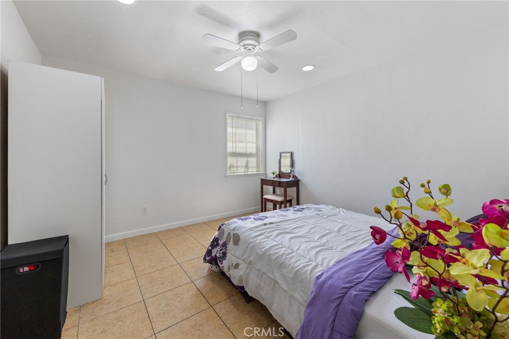 1312 West Commonwealth Avenue Fullerton, CA 92833 - Photo 12 of 39 a bedroom with a bed and a chandelier