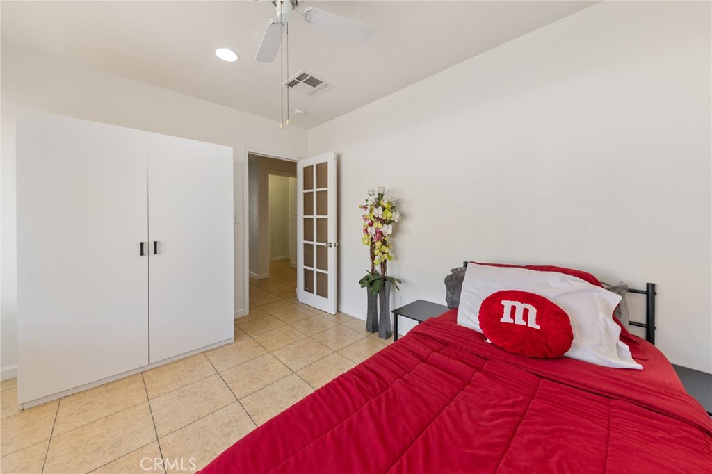 1312 West Commonwealth Avenue Fullerton, CA 92833 - Photo 13 of 39 a bedroom with a bed and a table