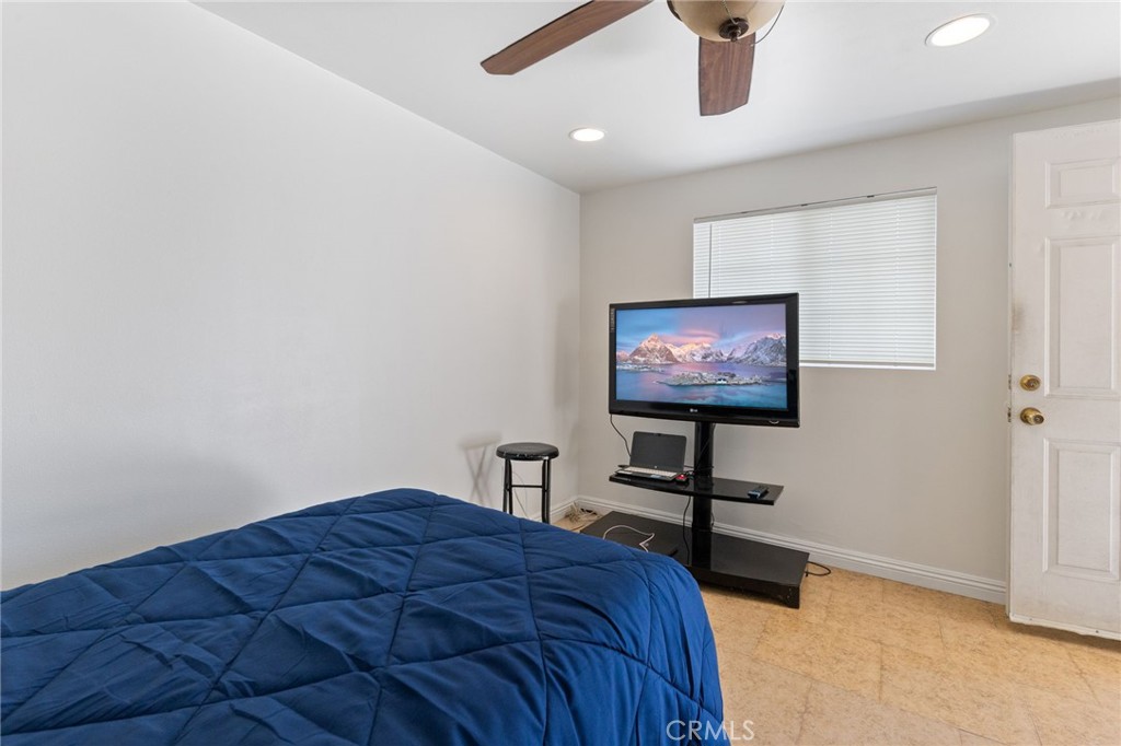 1312 West Commonwealth Avenue Fullerton, CA 92833 - Photo 18 of 39 a bedroom with a bed and a a flat screen tv