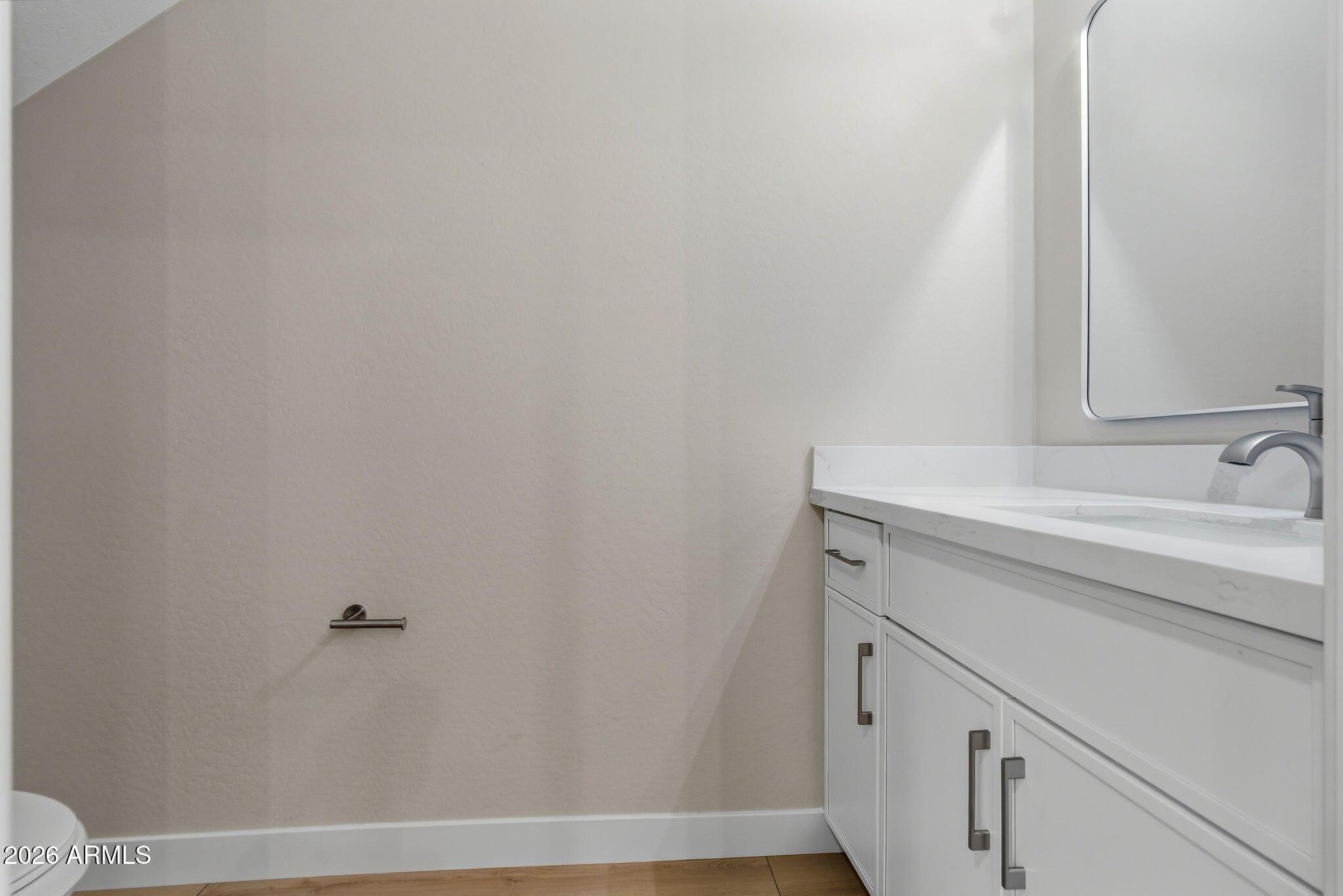 1222 East Diamond Street, Unit 2 Phoenix, AZ 85006 - Photo 18 of 35 a bathroom with a sink and a mirror