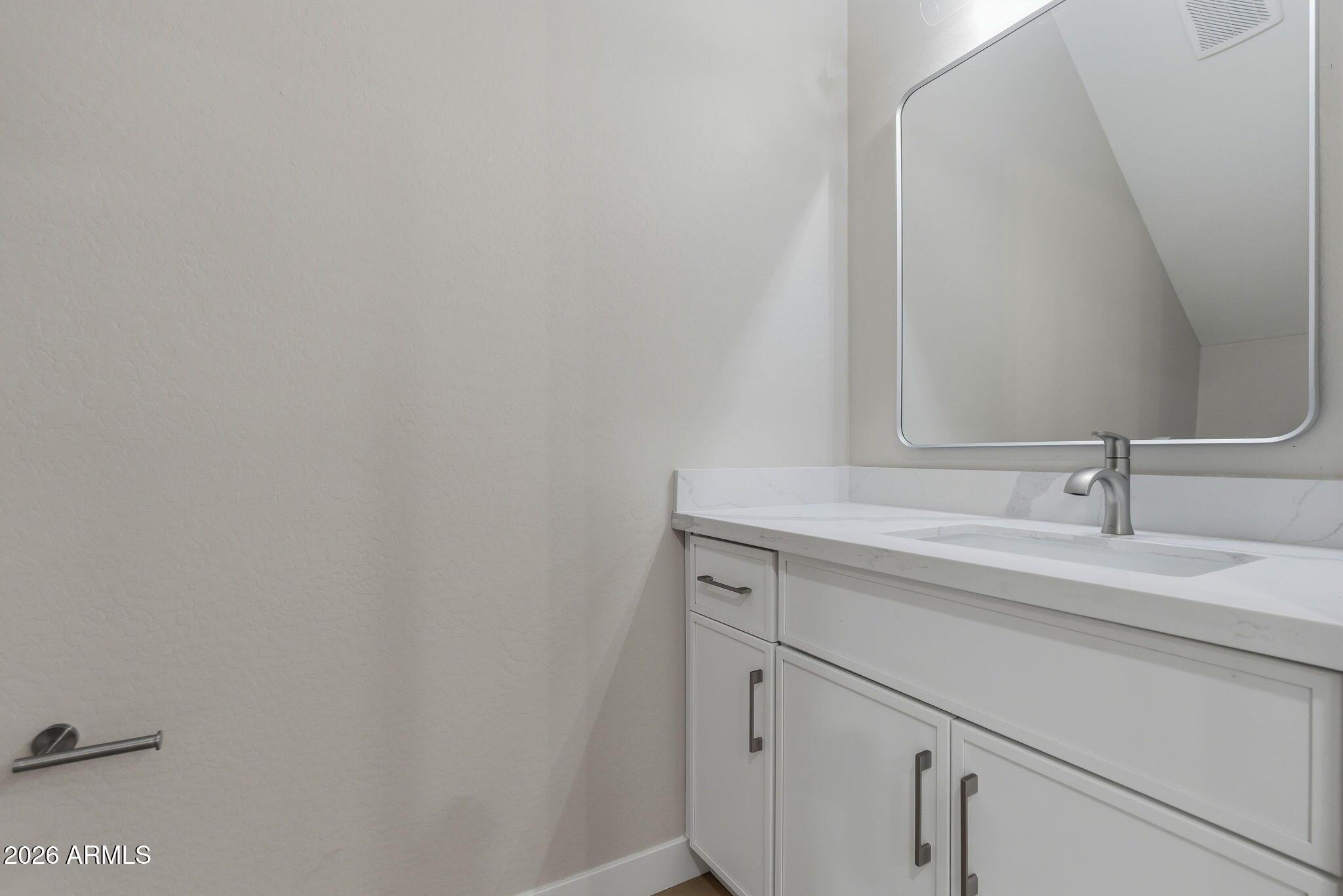 1222 East Diamond Street, Unit 2 Phoenix, AZ 85006 - Photo 19 of 35 a bathroom with a sink and vanity