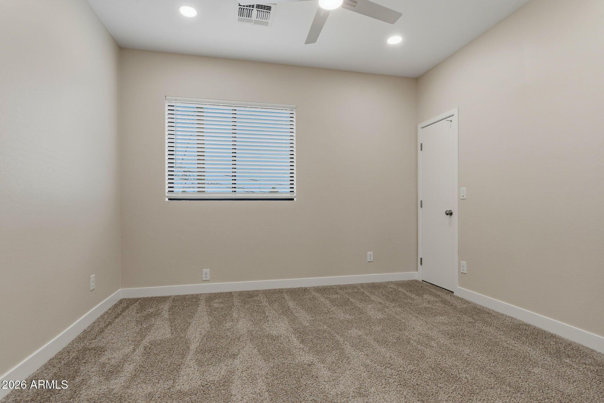 1222 East Diamond Street, Unit 2 Phoenix, AZ 85006 - Photo 24 of 35 an empty room with a window