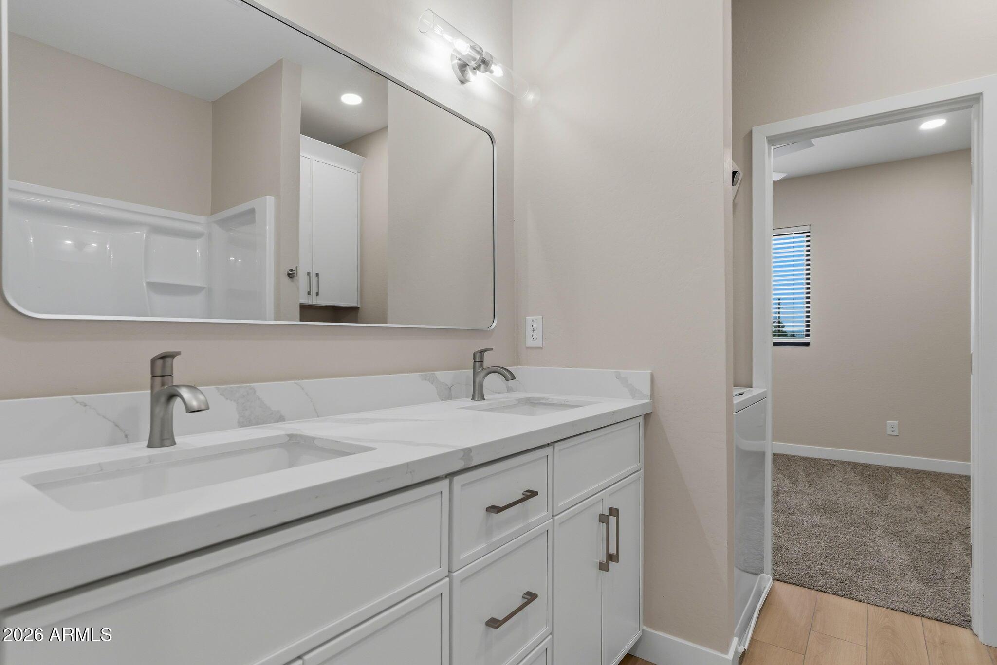 1222 East Diamond Street, Unit 2 Phoenix, AZ 85006 - Photo 26 of 35 a bathroom with a sink and a mirror