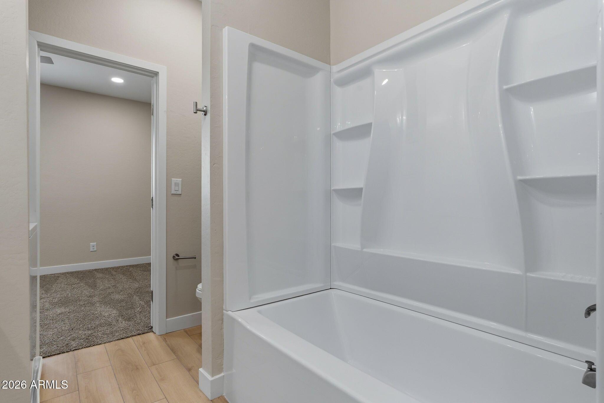 1222 East Diamond Street, Unit 2 Phoenix, AZ 85006 - Photo 27 of 35 a bathroom with a bathtub
