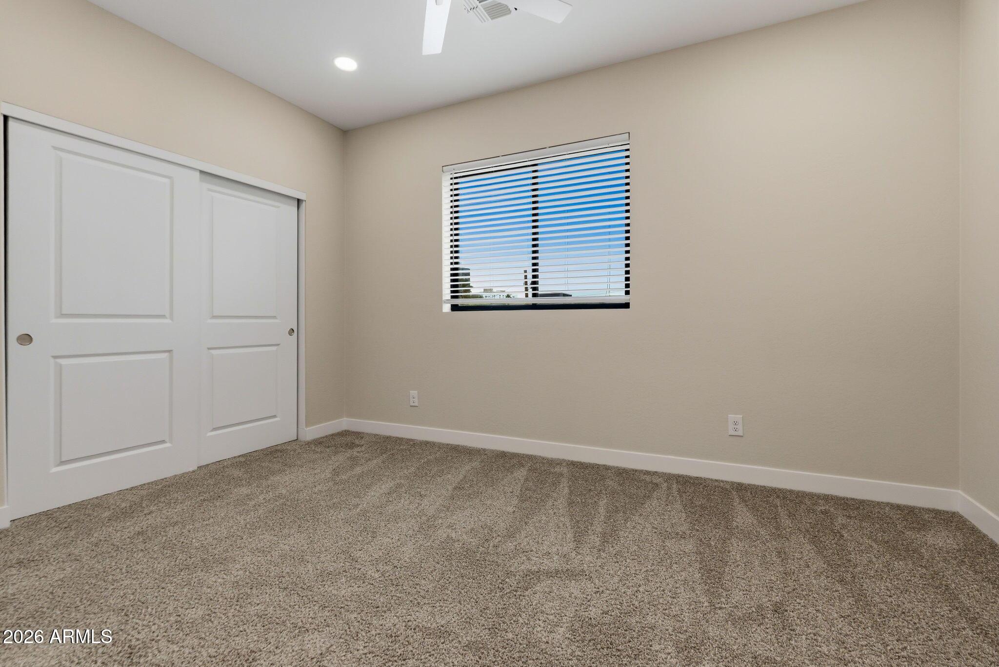 1222 East Diamond Street, Unit 2 Phoenix, AZ 85006 - Photo 31 of 35 an empty room with windows