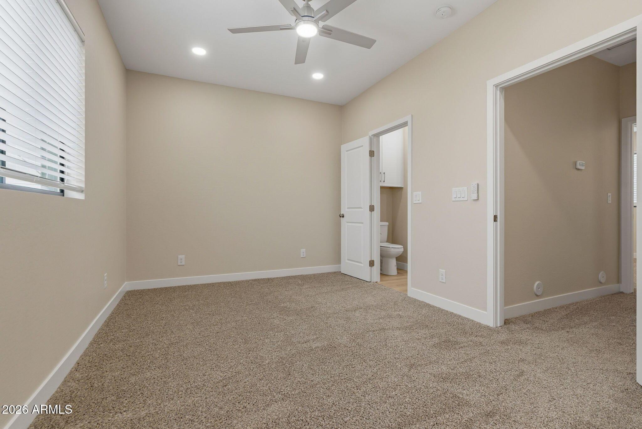 1222 East Diamond Street, Unit 2 Phoenix, AZ 85006 - Photo 34 of 35 an empty room with fan and entrance