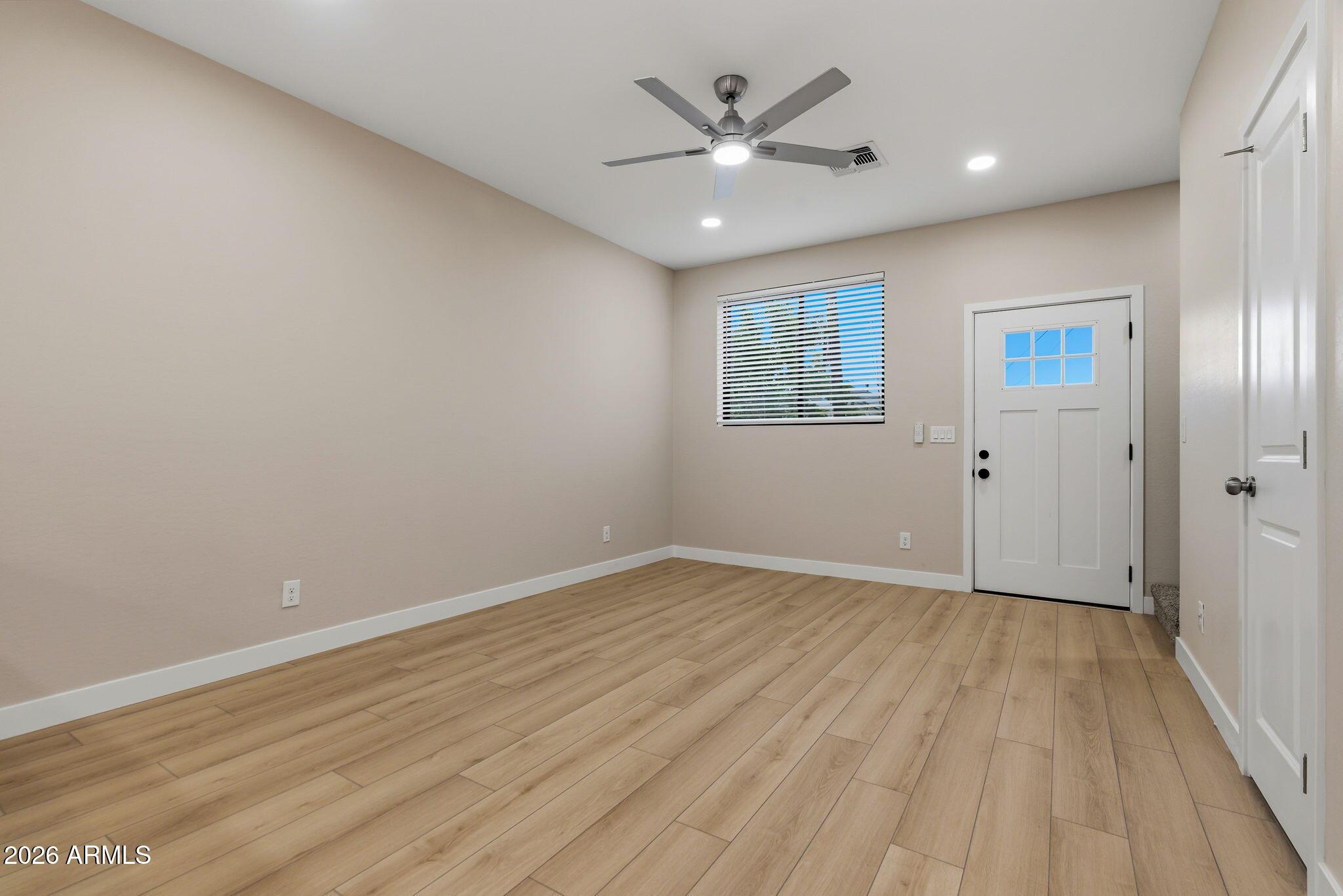 1222 East Diamond Street, Unit 2 Phoenix, AZ 85006 - Photo 4 of 35 wooden floor in an empty room with a window