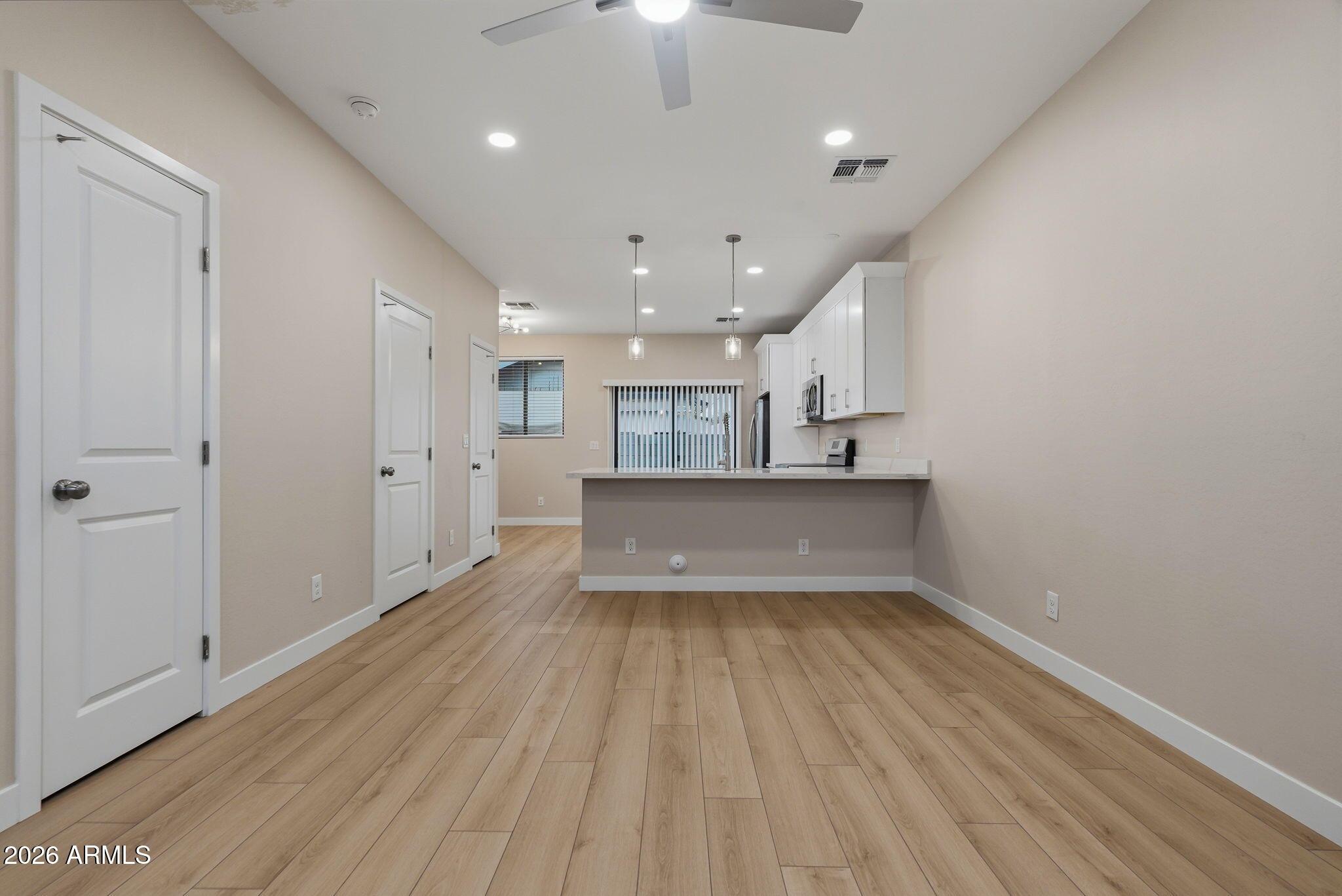 1222 East Diamond Street, Unit 2 Phoenix, AZ 85006 - Photo 7 of 35 a view of kitchen and a window with wooden floor