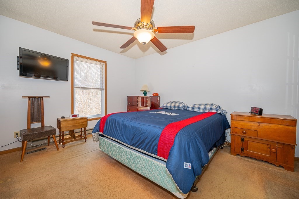 315 Keys Road Warren, MA 01585 - Photo 12 of 25 a bedroom with a bed and a flat screen tv