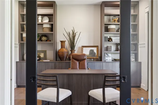 a dining room with furniture and wooden floor