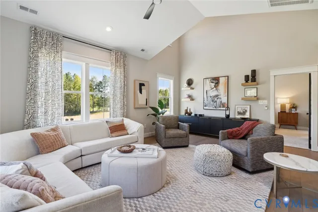 a living room with furniture and a large window
