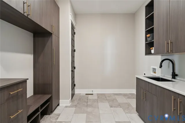 a kitchen with a sink and cabinets