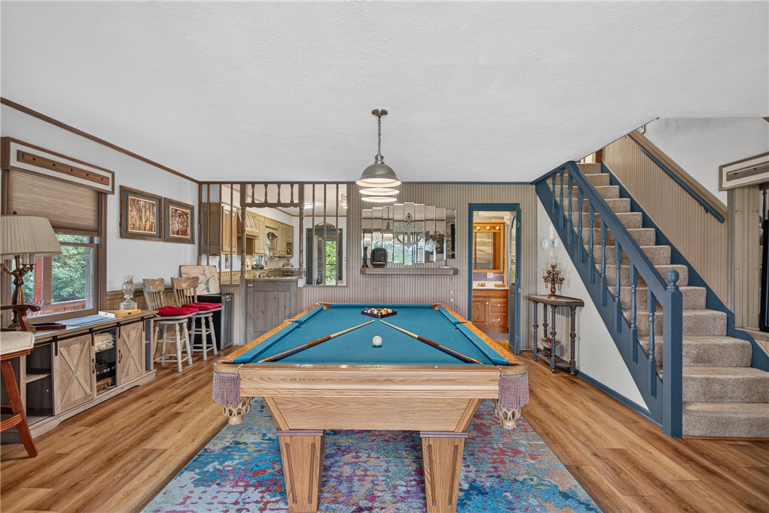 351 River Road Westminster, SC 29693 - Photo 13 of 50 A vibrant game room with room for a billiard table and access to a full kitchen, ideal for entertaining.