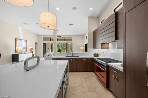 a kitchen with stainless steel appliances granite countertop a stove and a sink