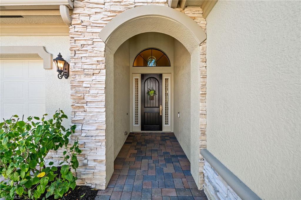 14686 Reserve Place Naples, FL 34109 - Photo 2 of 49 a view of a door of the house
