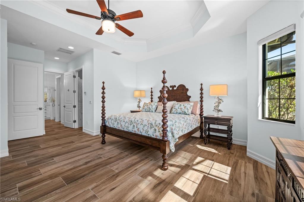 14686 Reserve Place Naples, FL 34109 - Photo 21 of 49 a bedroom with a bed furniture and a window