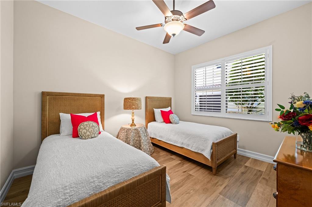 14686 Reserve Place Naples, FL 34109 - Photo 25 of 48 A stylish guest room with neutral tones and a relaxed coastal feel.