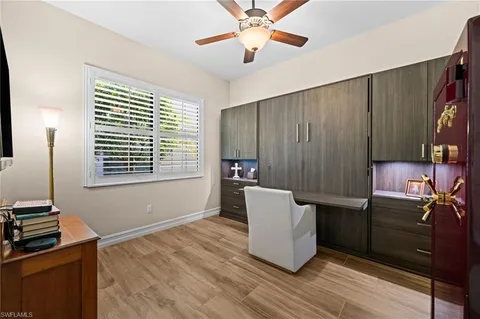 a view of a kitchen with workspace and windows