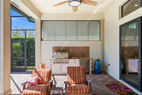 a view of a backyard with sitting area