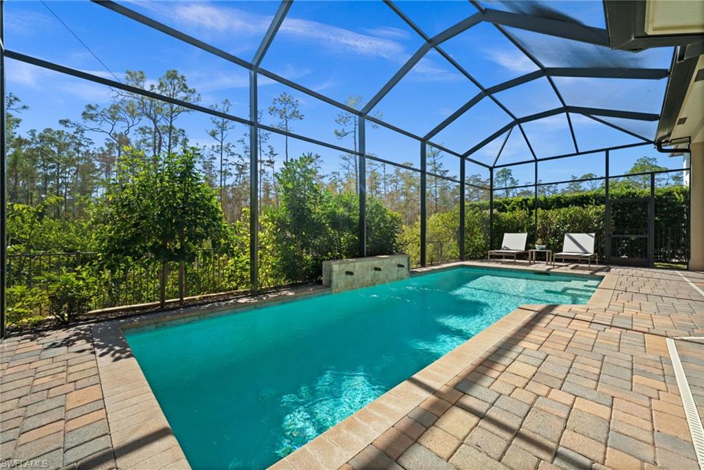 14686 Reserve Place Naples, FL 34109 - Photo 38 of 48 Your private retreat, a solar-heated saltwater pool surrounded by serene preserve views.