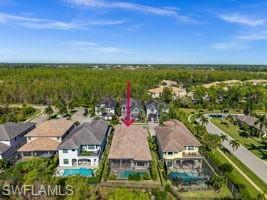 14686 Reserve Place Naples, FL 34109 - Photo 44 of 49 an aerial view of residential houses with outdoor space and ocean view