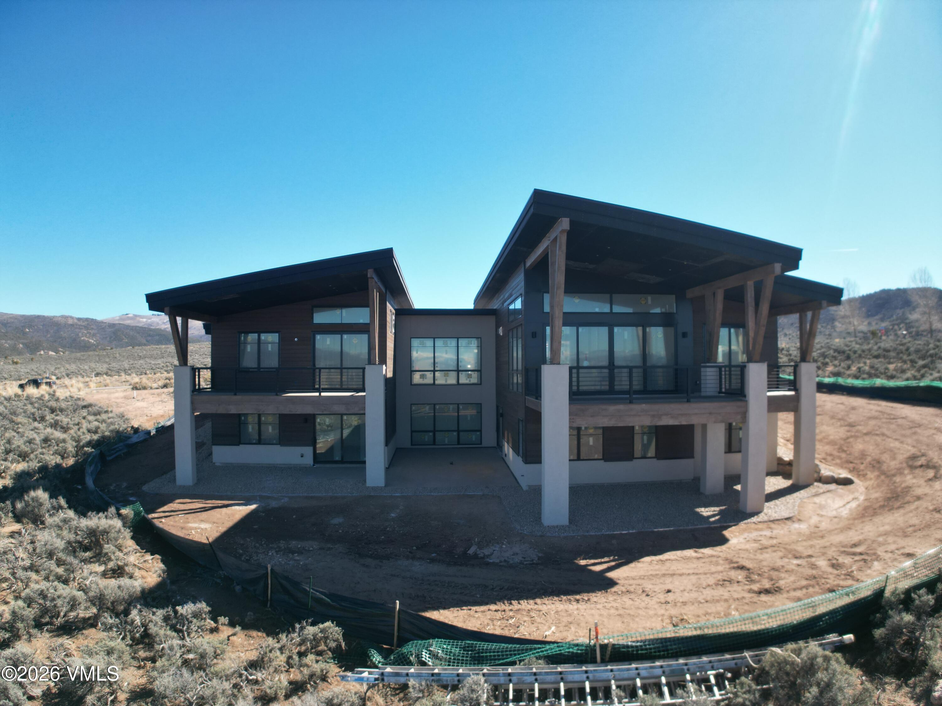 a backyard of a house with yard fire pit barbeque oven and outdoor seating