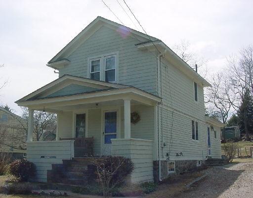 875 Cutspring Road Stratford, CT 06614 - Photo 1 of 1 a front view of a house with a yard