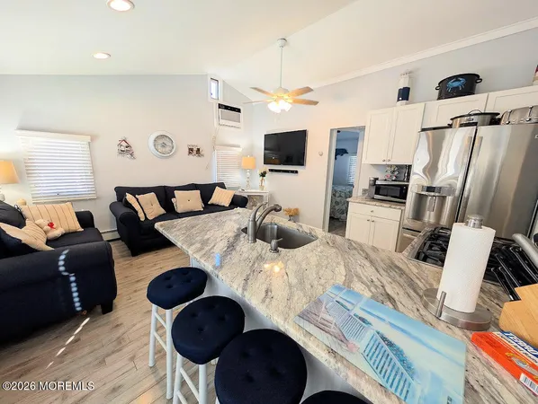 a living room with furniture and flat screen tv