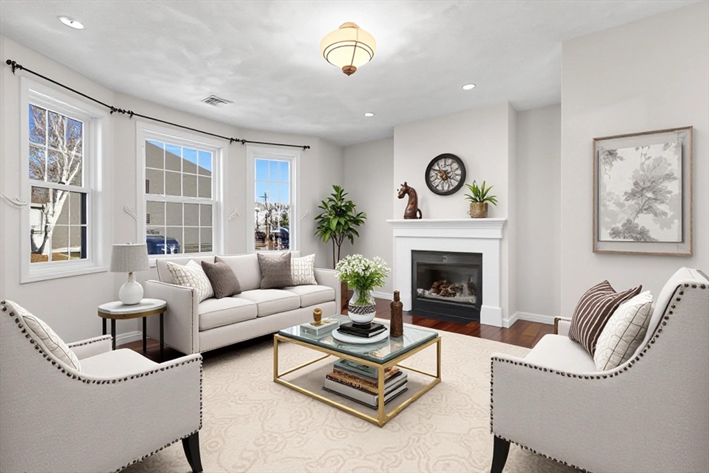 188 Beach Road, Unit 15 Salisbury, MA 01952 - Photo 11 of 39 a living room with furniture a table and a fireplace