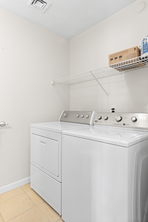 188 Beach Road, Unit 15 Salisbury, MA 01952 - Photo 14 of 39 a utility room with dryer and washer