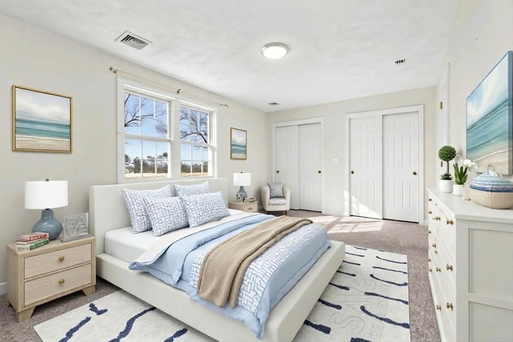 188 Beach Road, Unit 15 Salisbury, MA 01952 - Photo 15 of 39 a spacious bedroom with a bed and a lamp