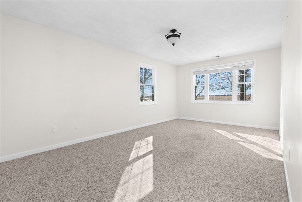 188 Beach Road, Unit 15 Salisbury, MA 01952 - Photo 20 of 39 an empty room with windows