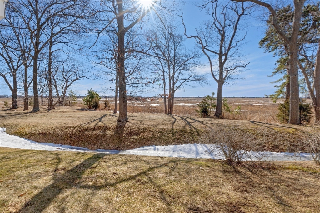 188 Beach Road, Unit 15 Salisbury, MA 01952 - Photo 32 of 39 a view of a yard covered with snow
