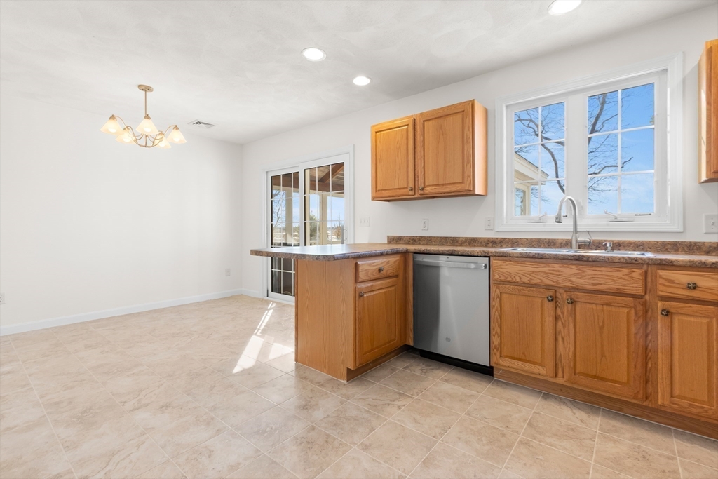 188 Beach Road, Unit 15 Salisbury, MA 01952 - Photo 8 of 39 a kitchen with cabinets a sink and appliances