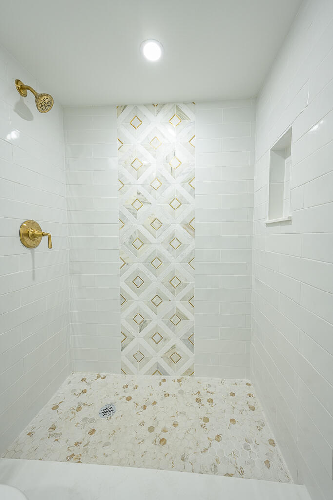 356 Prestwick Circle, Unit 3 Palm Beach Gardens, FL 33418 - Photo 13 of 42 a bathroom with a shower