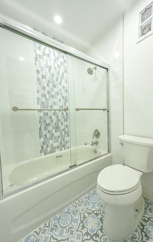 356 Prestwick Circle, Unit 3 Palm Beach Gardens, FL 33418 - Photo 25 of 42 a bathroom with a toilet and a shower