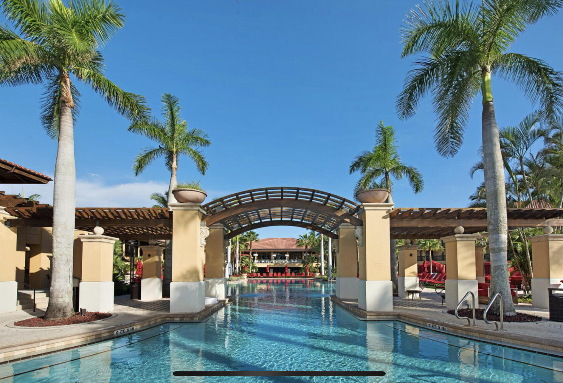 356 Prestwick Circle, Unit 3 Palm Beach Gardens, FL 33418 - Photo 39 of 42 swimming pool with outdoor seating